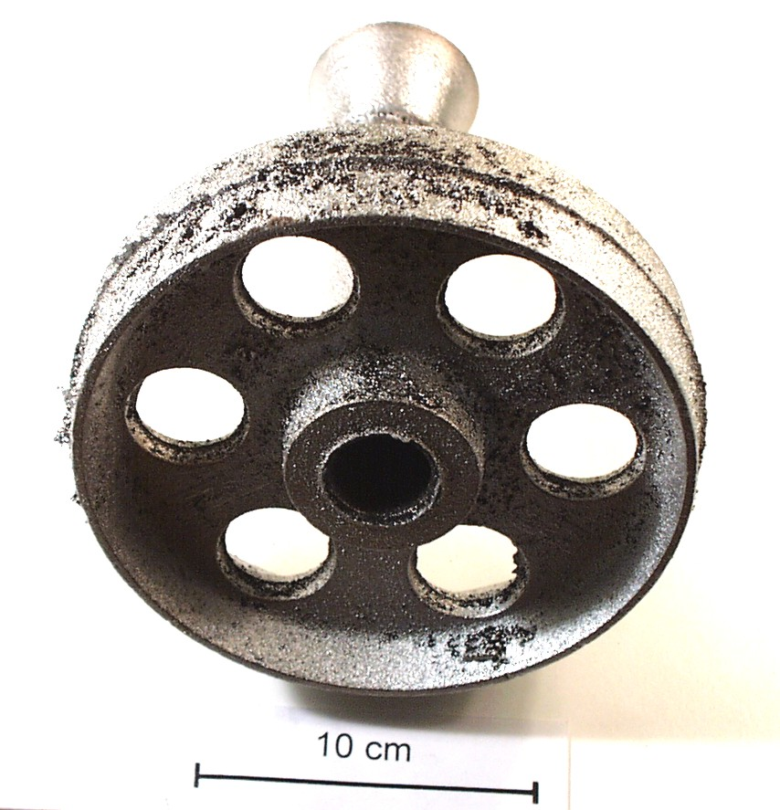 Fig. 2: Burnt sand on a casting made of an aluminum alloy; the causes for this defect are insufficient compaction of the mold and too high casting temperatures