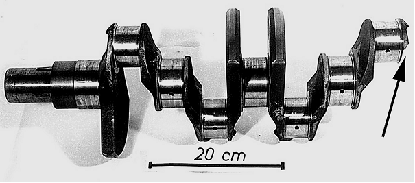 Fig. 5: Broken crankshaft at the main bearing journal; the casting was cut from the oil bore thus allowing for the formation of microporosity in the thermal center (s. Fig. 6); Due to high torsional fatigue loading this defect resulted in failure